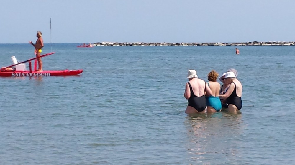 Check out these grandma friends walking in the water and picking up the baywatch guard ;))  I want to be just like them one day!