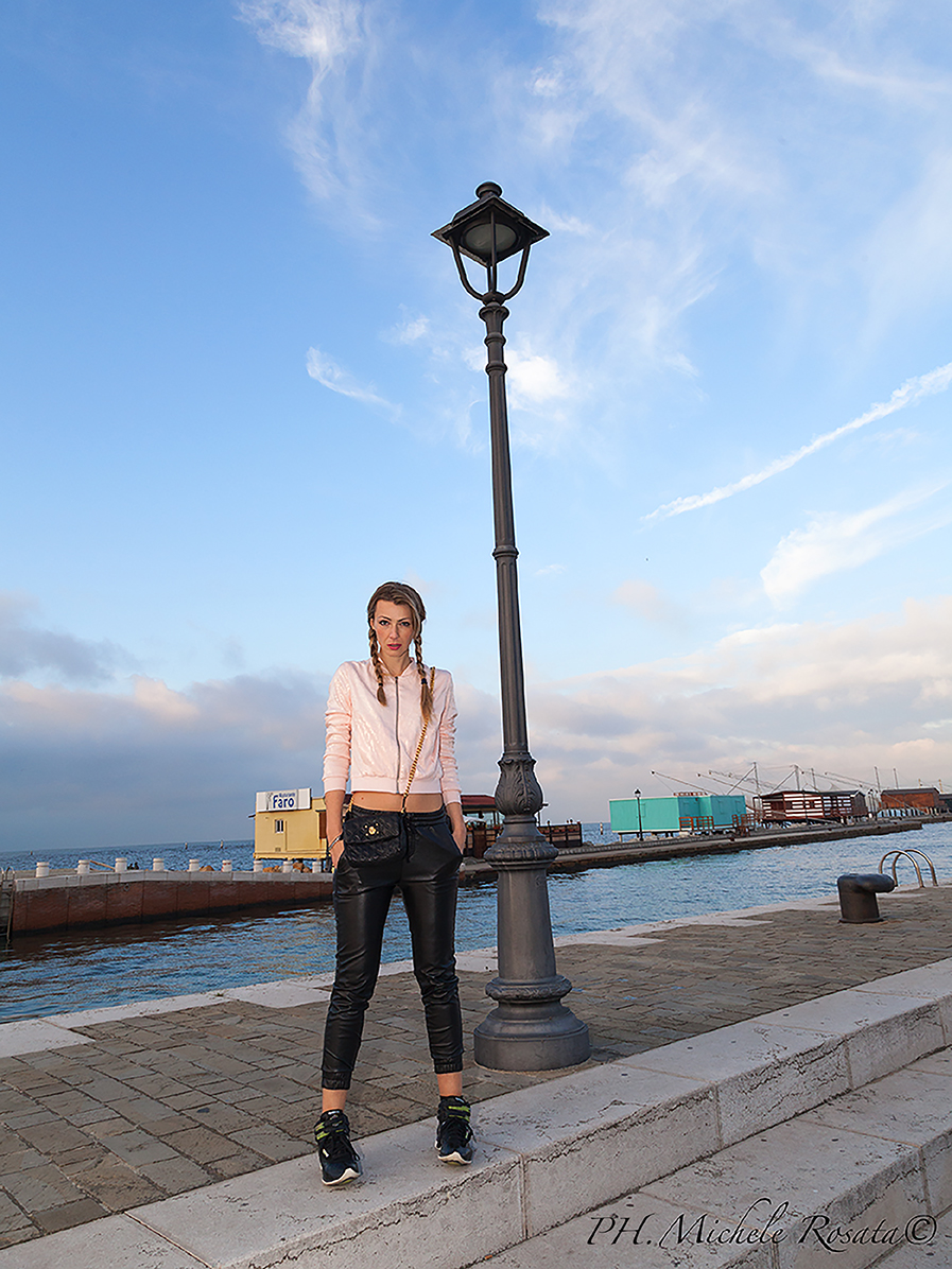 black pleather pants and pink sequence sport top