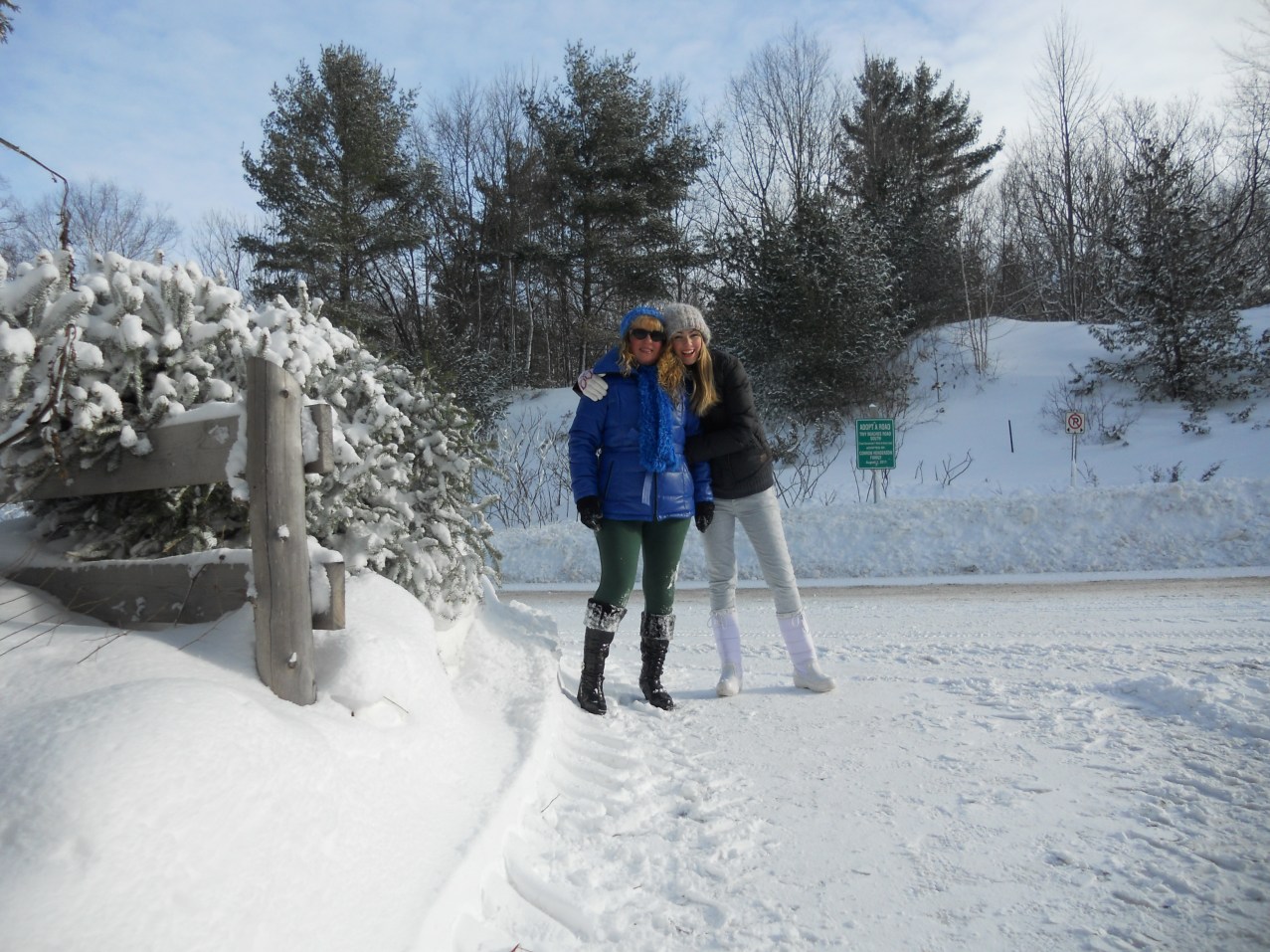 mother and daughter in canada winter forest