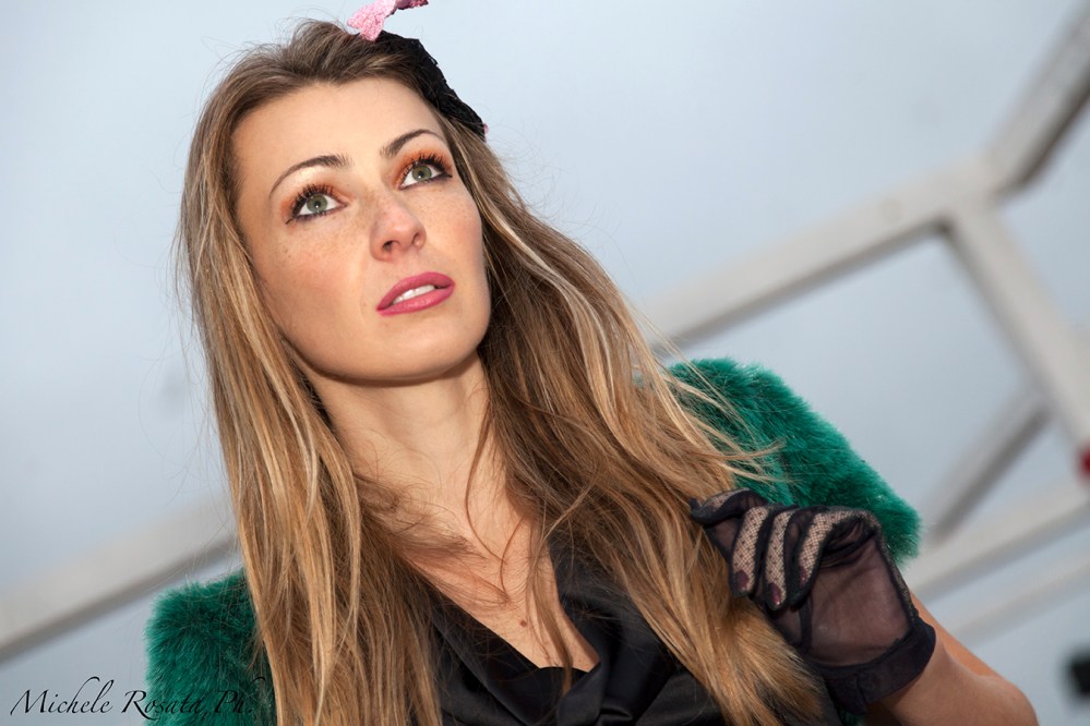 pretty girl forties look with a hat, gloves and fur vest